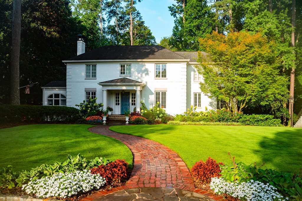 Landscaped front yard with flowered path