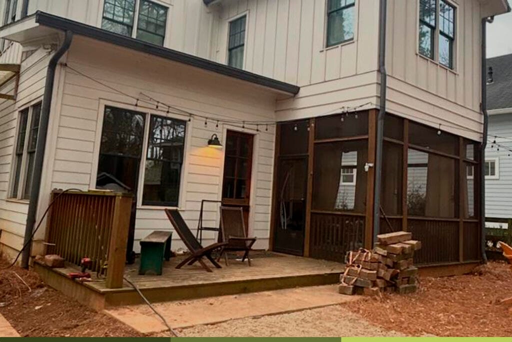 a house with a deck and chairs